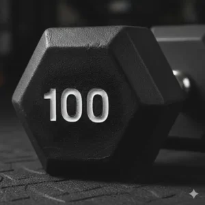 Close-up of the protective rubber coating on a 100 lb dumbbell designed to reduce noise and floor damage.